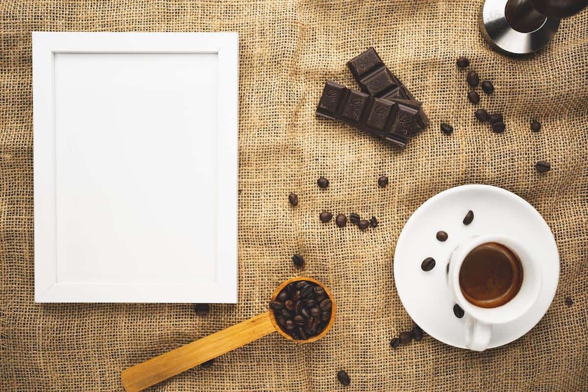 Delicious chocolate covered coffee beans placed in a small glass jar