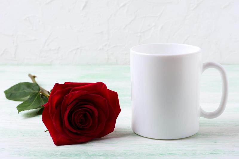 Beautiful roses complemented by a cup of coffee, creating an enchanting visual contrast