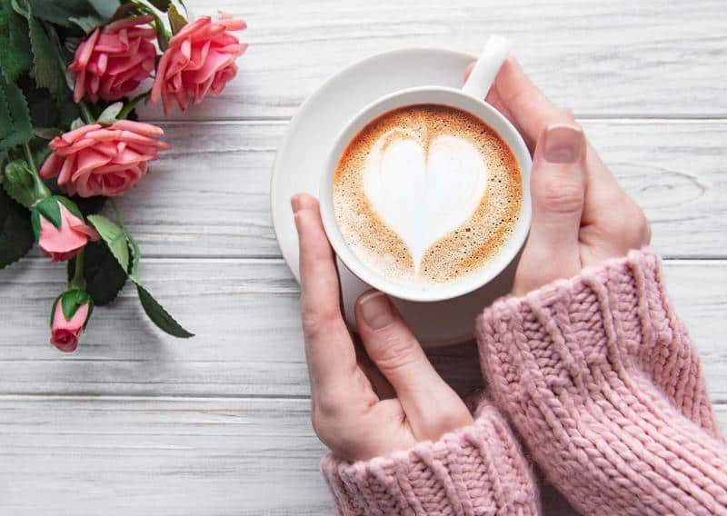 Woman holding cup of coffee