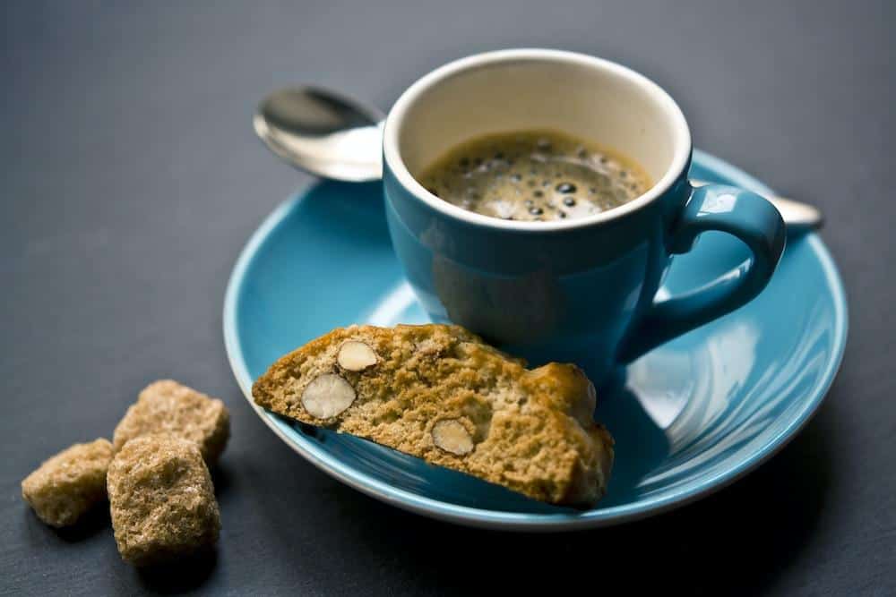 A cozy café scene in germany, showcasing a piping hot cup of deliciously brewed coffee