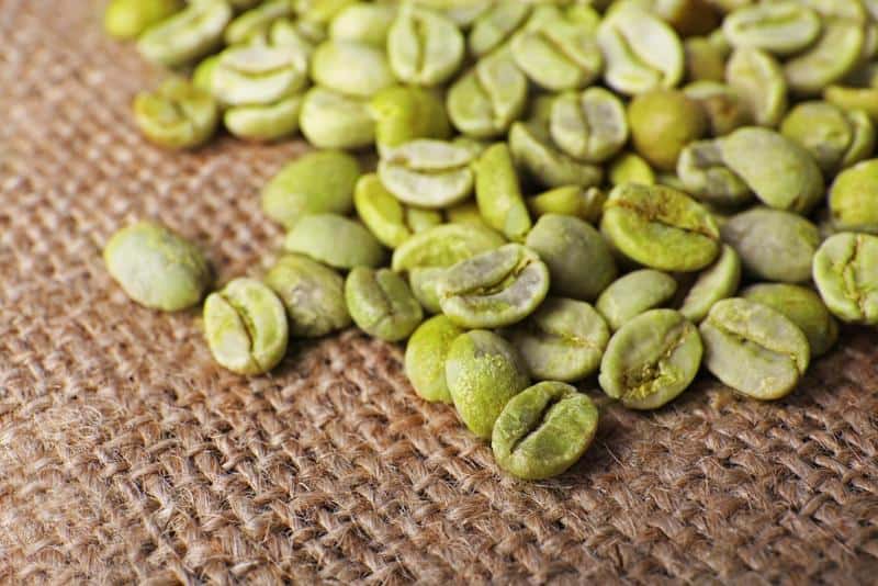 Green coffee beans on a sackcloth