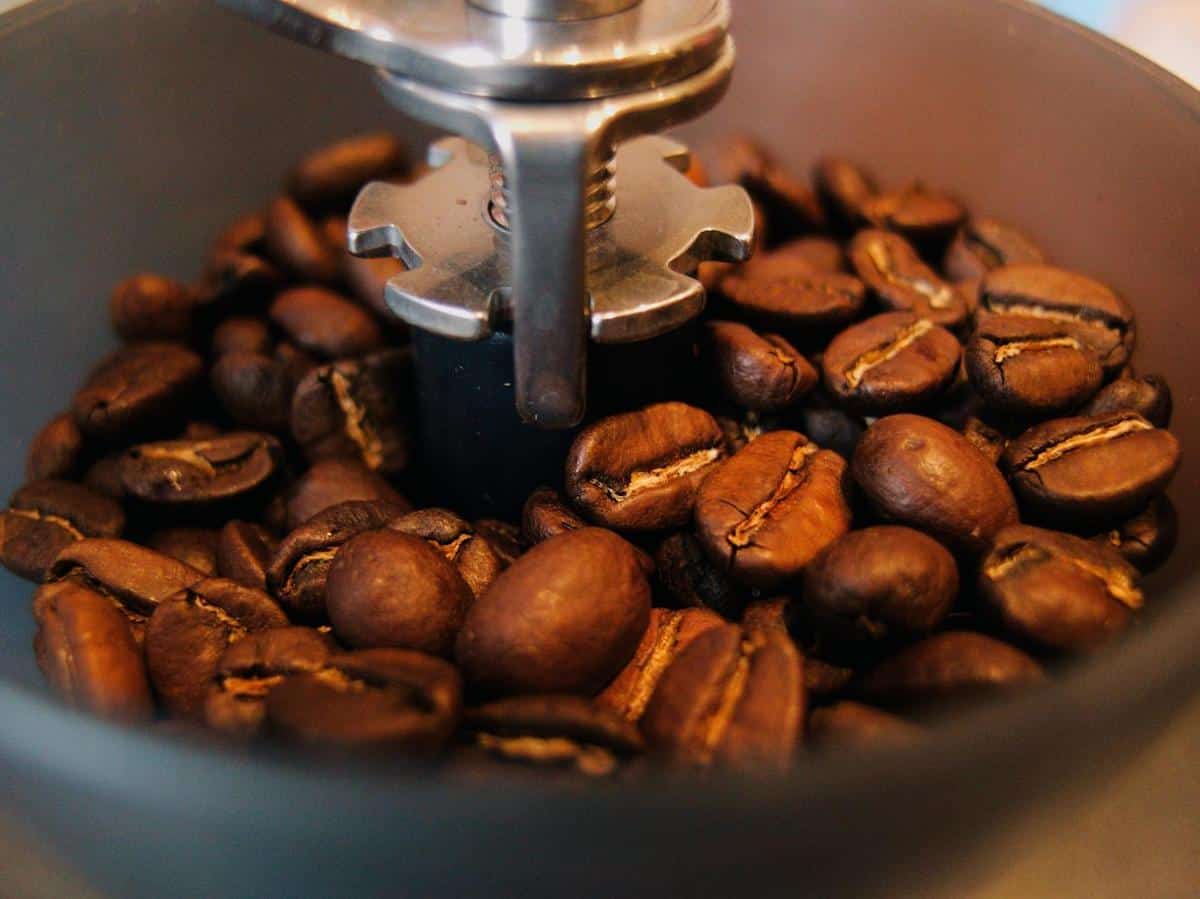 A close-up of grinding coffee beans to achieve the ideal consistency