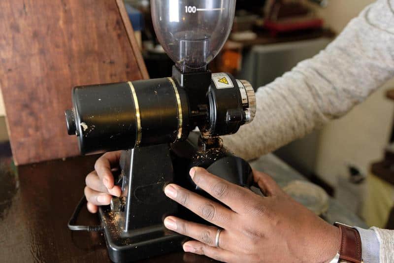 Experience the satisfying process of grinding coffee beans for a delicious cup of joe