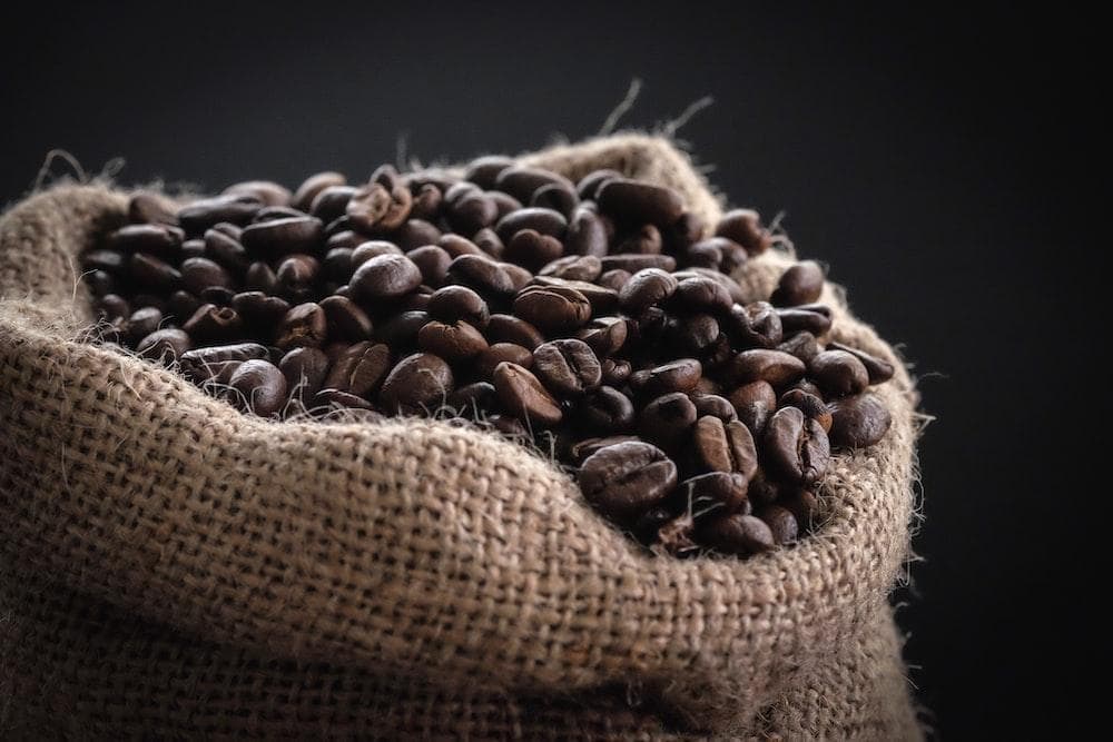 Shallow focus photography of coffee beans in sack