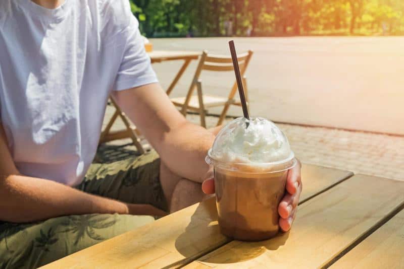 A tempting coffee beverage adorned with a mound of fluffy whipped cream